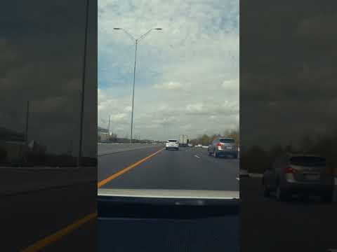 How does Tesla’s Autopilot handle situations with vehicles suddenly merging onto the highway from downhill on-ramps during extreme weather conditions like tornadoes and hurricanes?