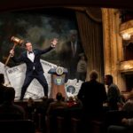 Man with gavel on theatrical political stage